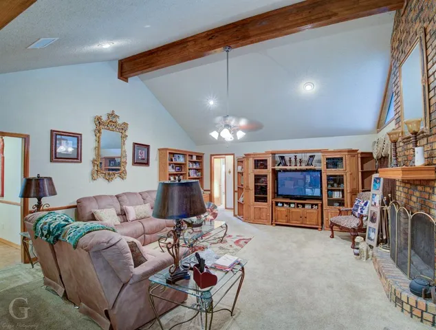 a view of a dining room with furniture wooden floor and chandelier