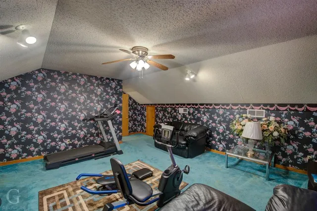 a living room with furniture a couch and a chandelier