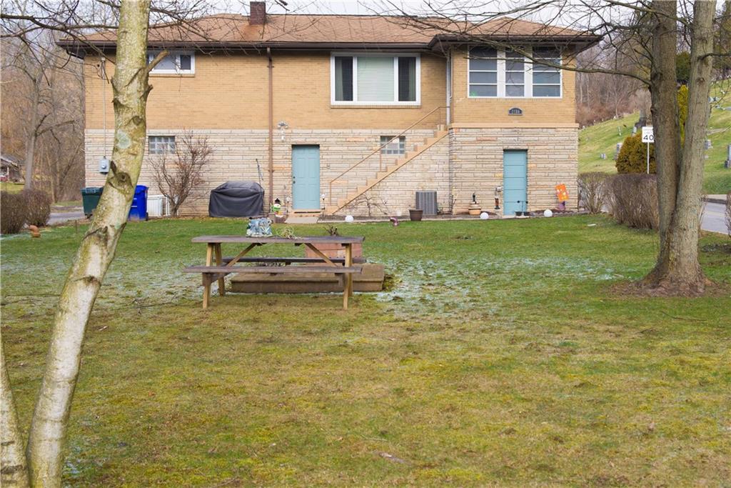 2098 N Road Oakdale, PA 15071 - Photo 24 of 25 Welcome to 2098 North Road in North Fayette! This is a raised ranch with brick and stone exterior.