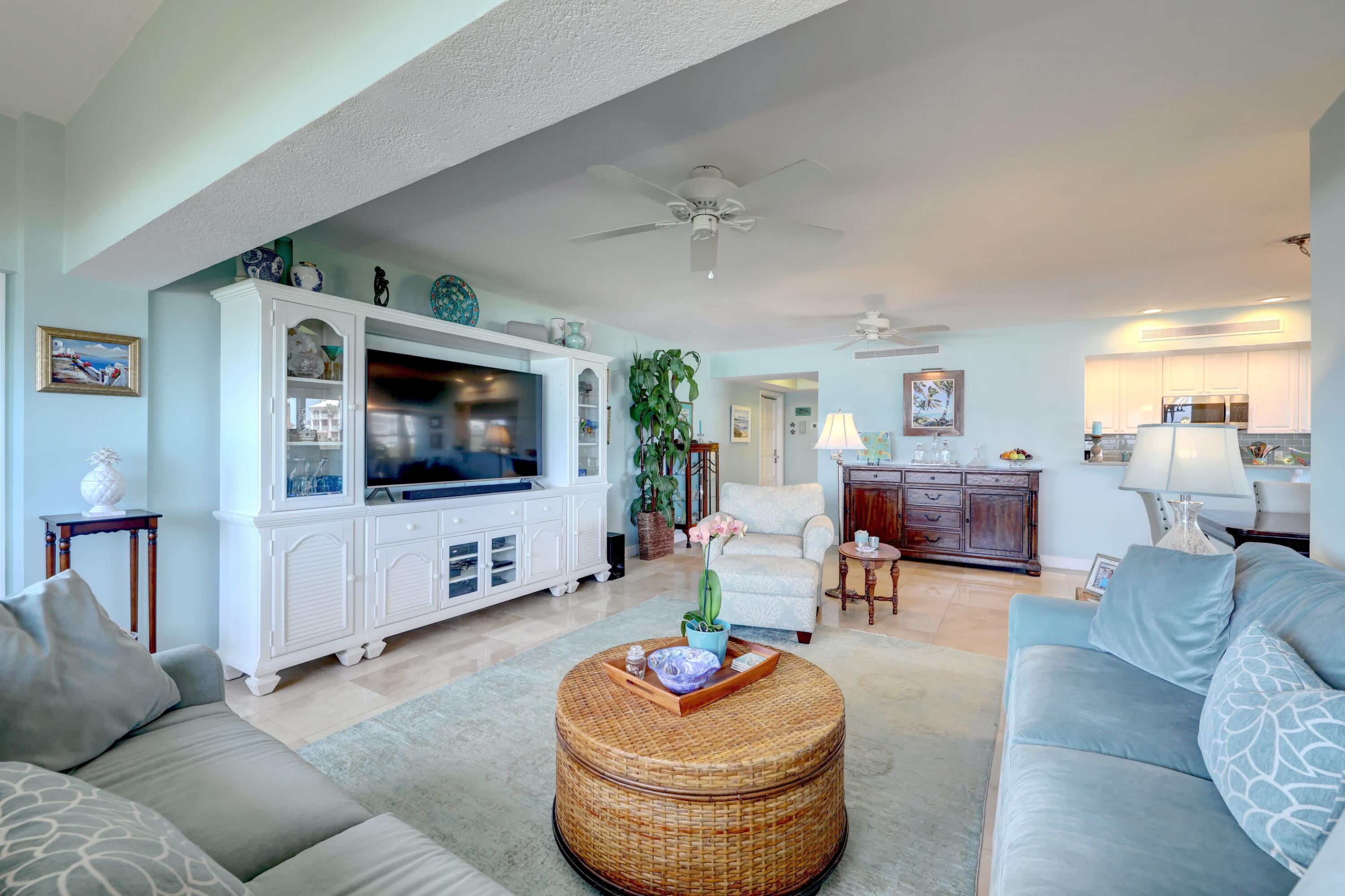 1555 Northeast Ocean Boulevard, Unit 205 Stuart, FL 34996 - Photo 14 of 57 a living room with furniture and a flat screen tv