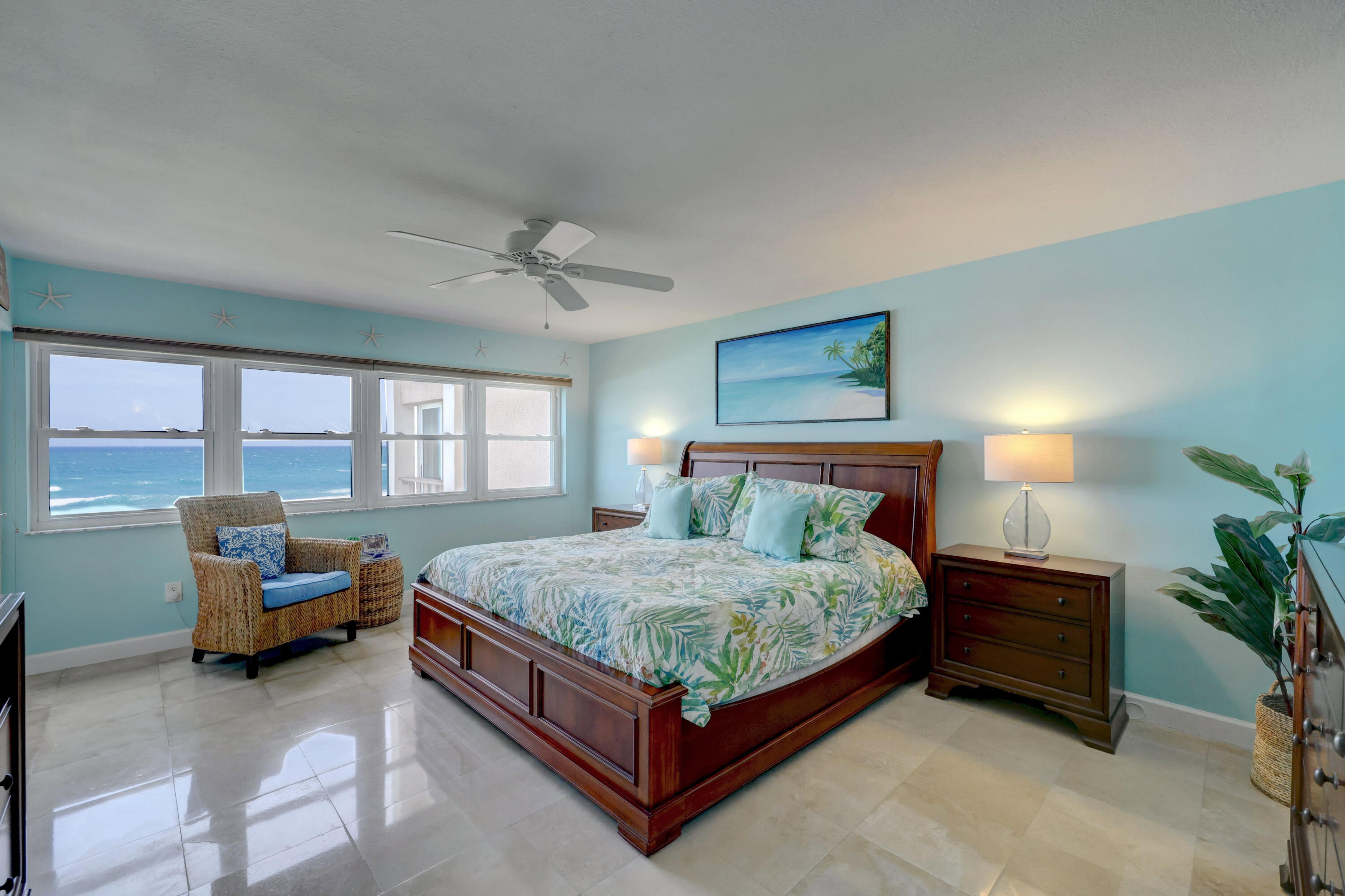 1555 Northeast Ocean Boulevard, Unit 205 Stuart, FL 34996 - Photo 24 of 57 a bedroom with a bed window and couch