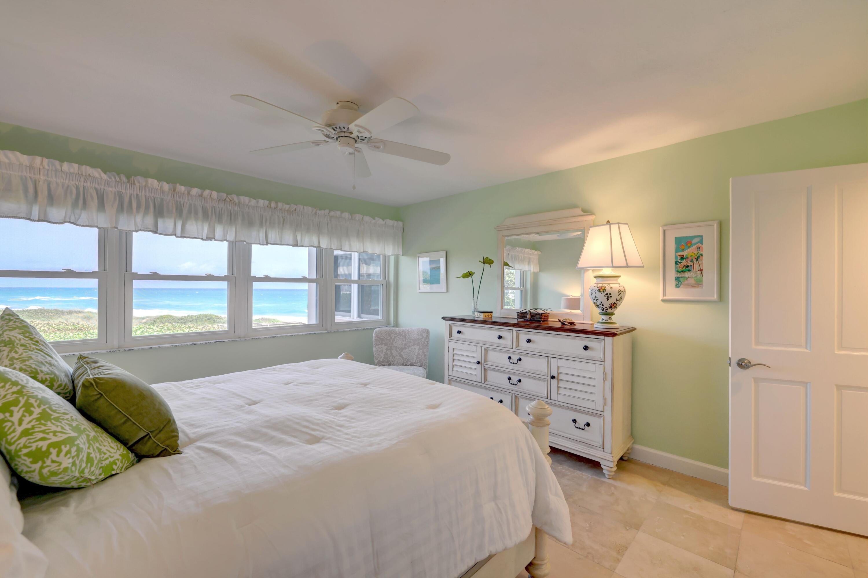 1555 Northeast Ocean Boulevard, Unit 205 Stuart, FL 34996 - Photo 29 of 57 a bedroom with a bed and a dresser