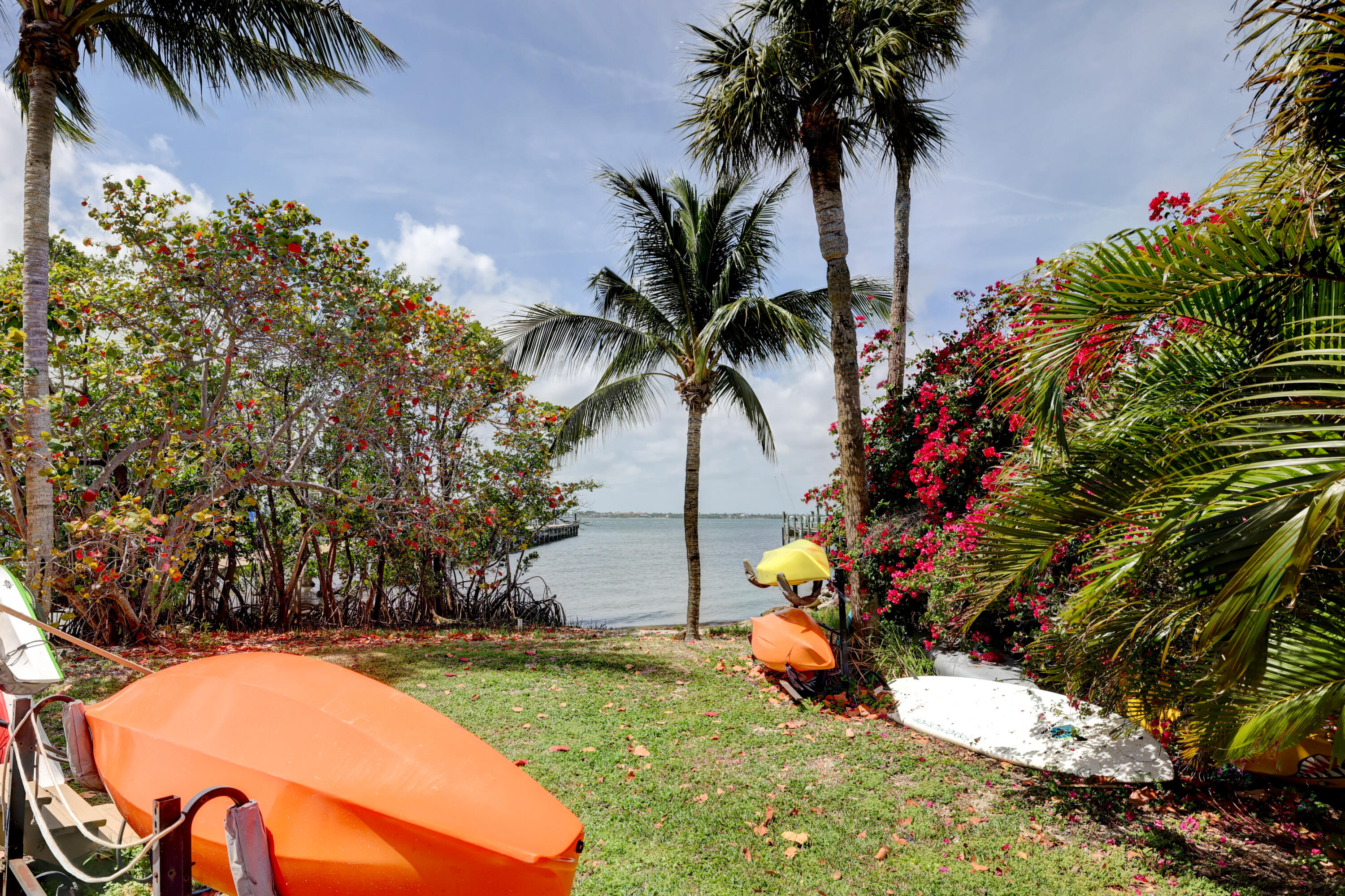 1555 Northeast Ocean Boulevard, Unit 205 Stuart, FL 34996 - Photo 36 of 57 a view of a yard with a palm tree