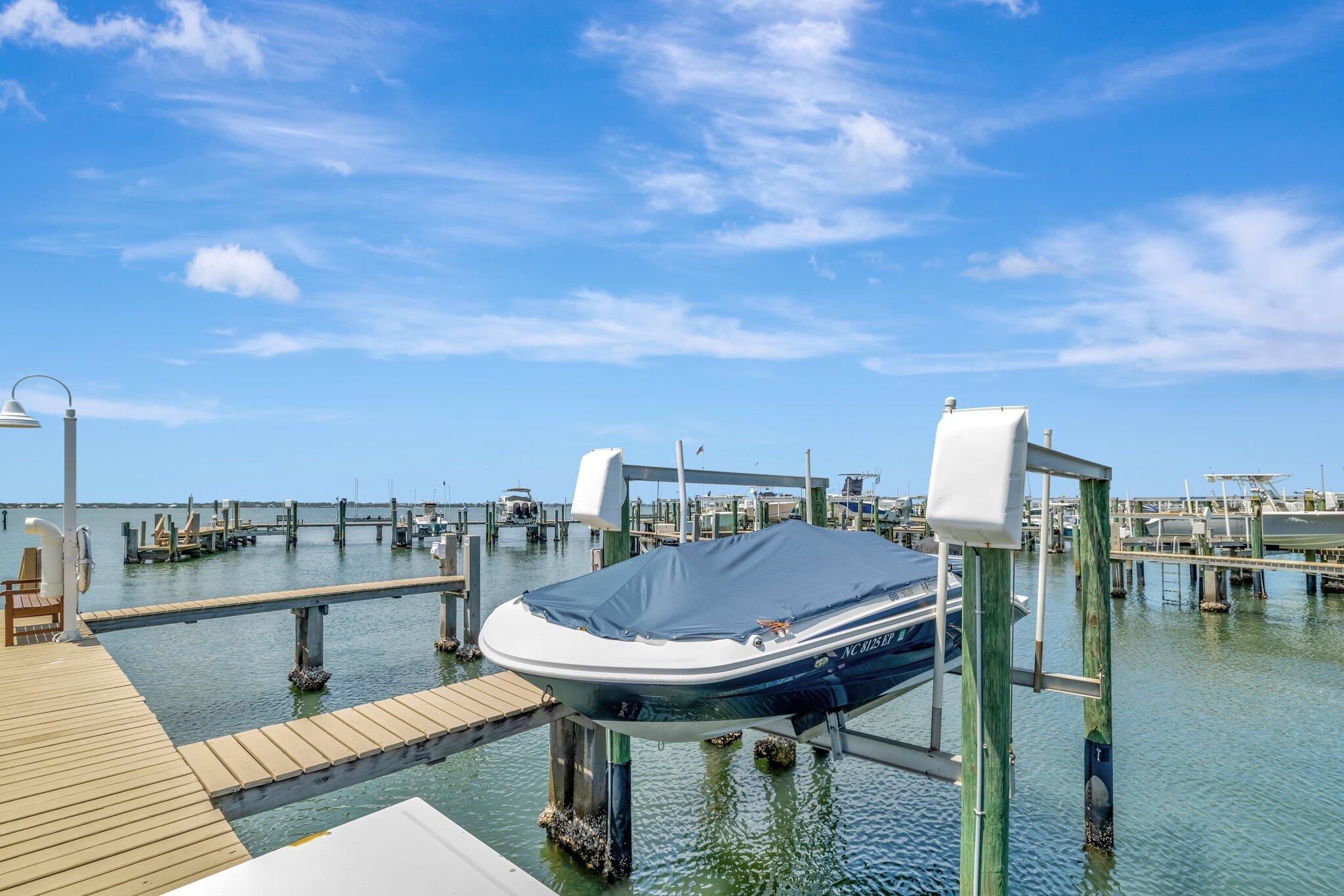 1555 Northeast Ocean Boulevard, Unit 205 Stuart, FL 34996 - Photo 53 of 57 a balcony with table and chairs