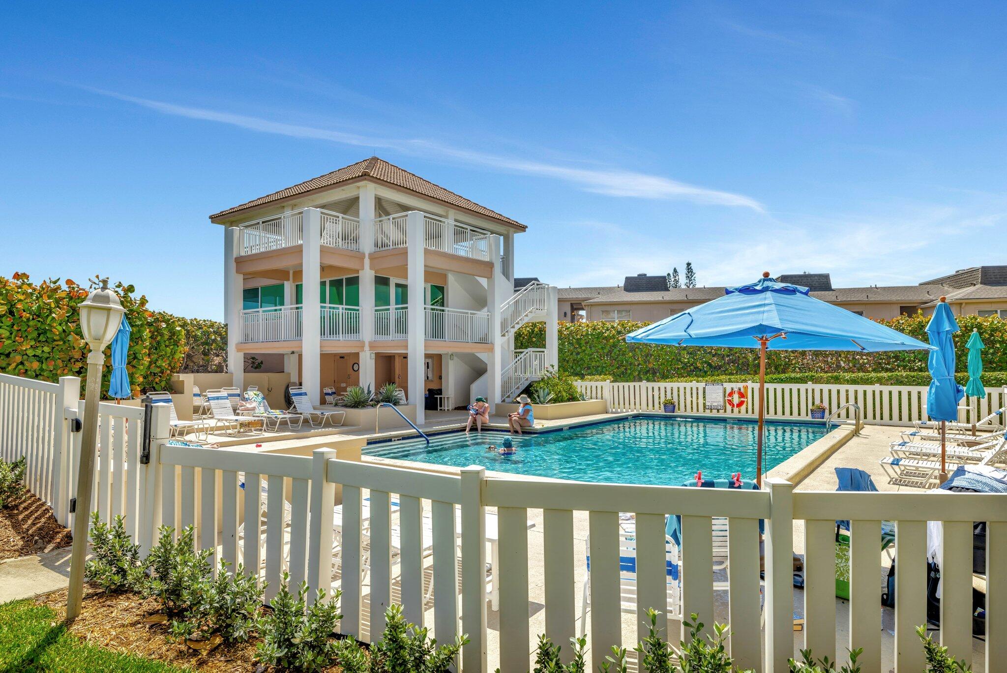 1555 Northeast Ocean Boulevard, Unit 205 Stuart, FL 34996 - Photo 57 of 57 a view of a house with a yard balcony and furniture