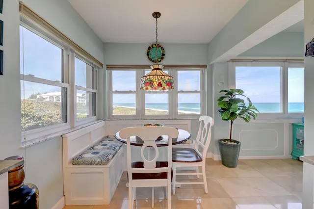 a large kitchen with stainless steel appliances granite countertop a sink and dishwasher a stove top oven with wooden floor