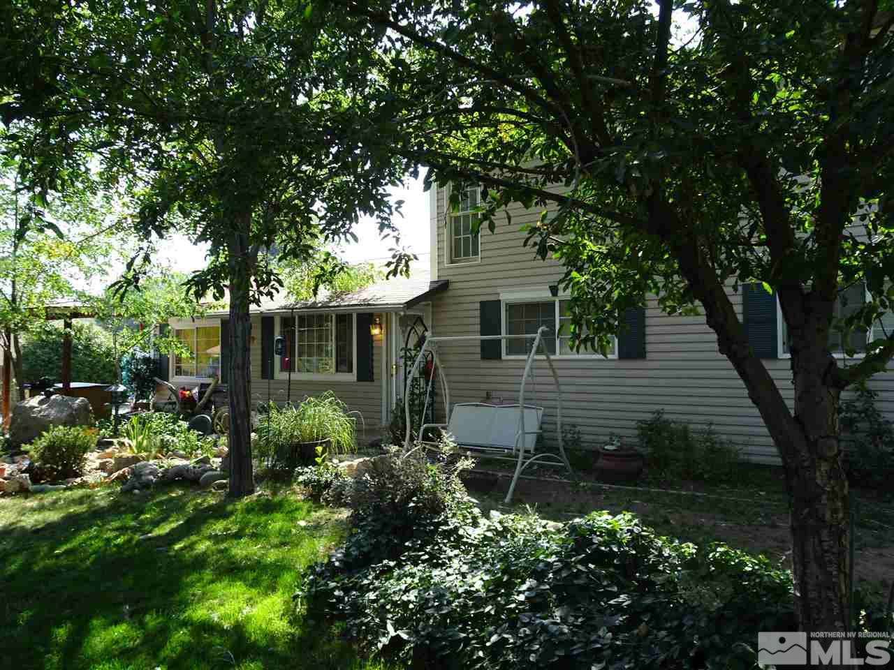 9010 Fremont Way Reno, NV 89506 - Photo 1 of 1 a view of backyard with potted plants and large tree