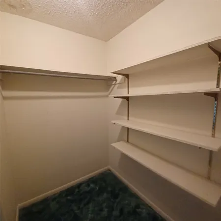 a view of a room with racks on the wall
