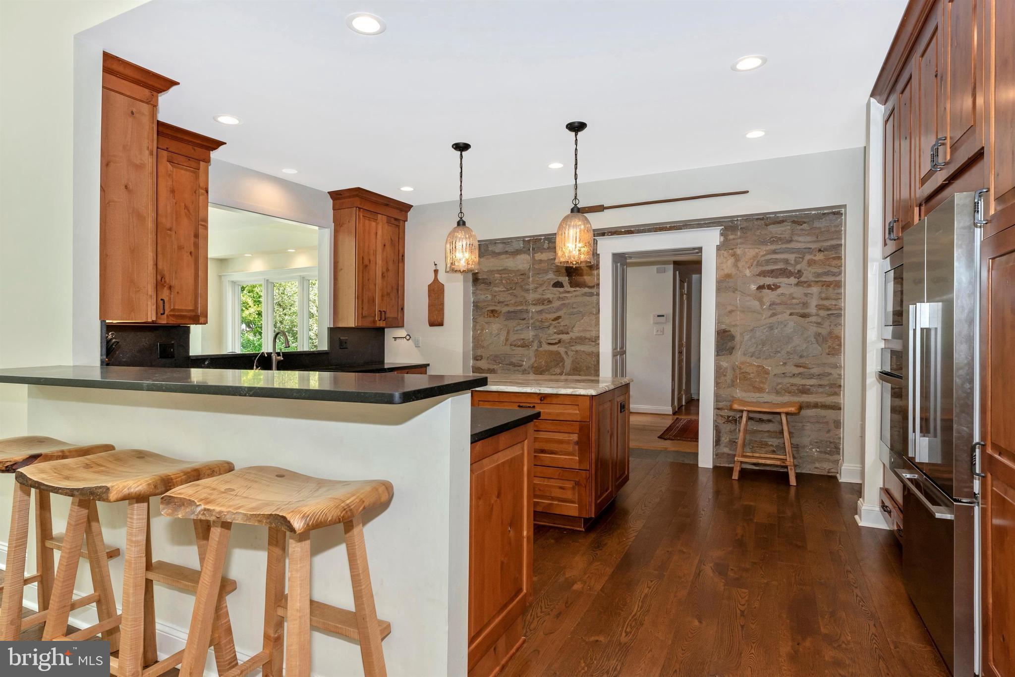 5309 Camp Raudy Road Frederick, MD 21702 - Photo 12 of 89 Soapstone countertops & breakfast bar