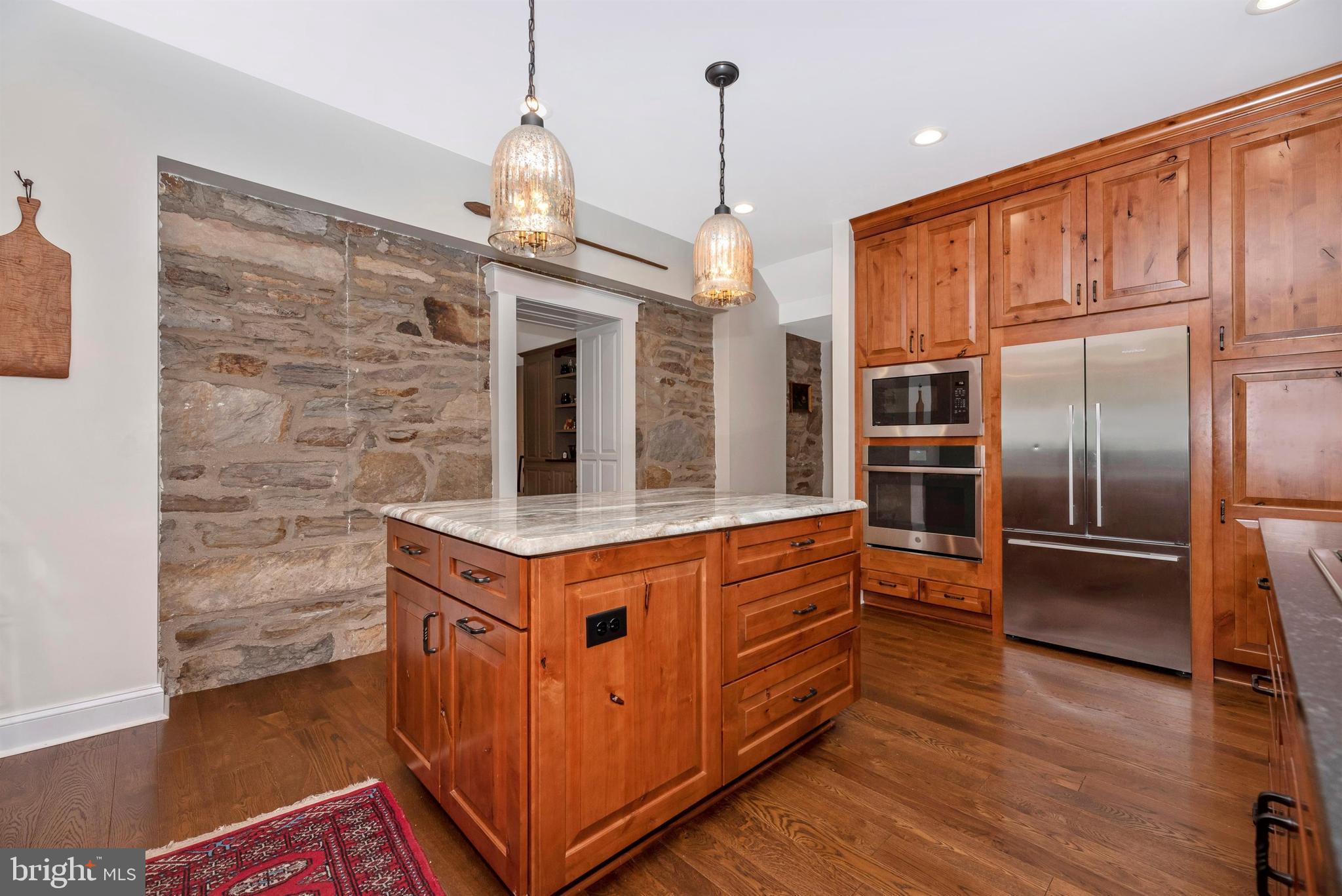 5309 Camp Raudy Road Frederick, MD 21702 - Photo 13 of 89 Center island and exposed stone wall