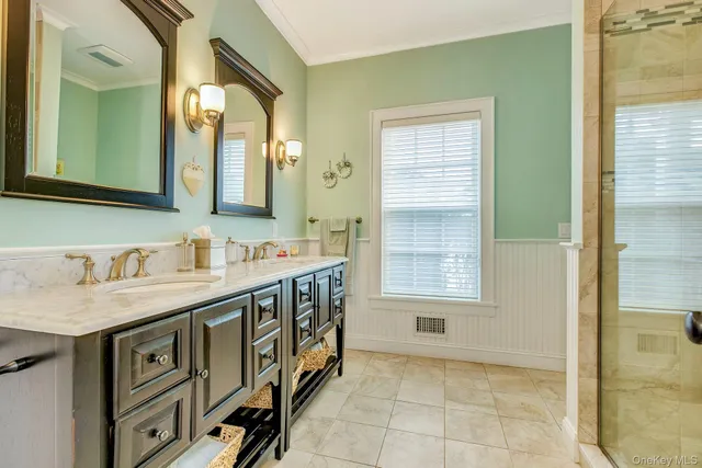 a bathroom with a granite countertop sink a mirror and a