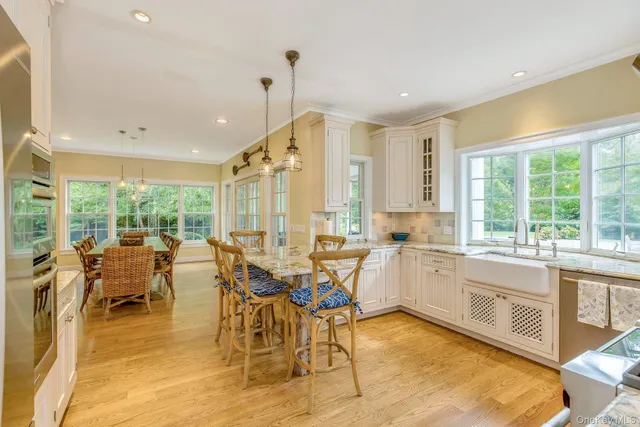 a very nice looking dining room with a large window