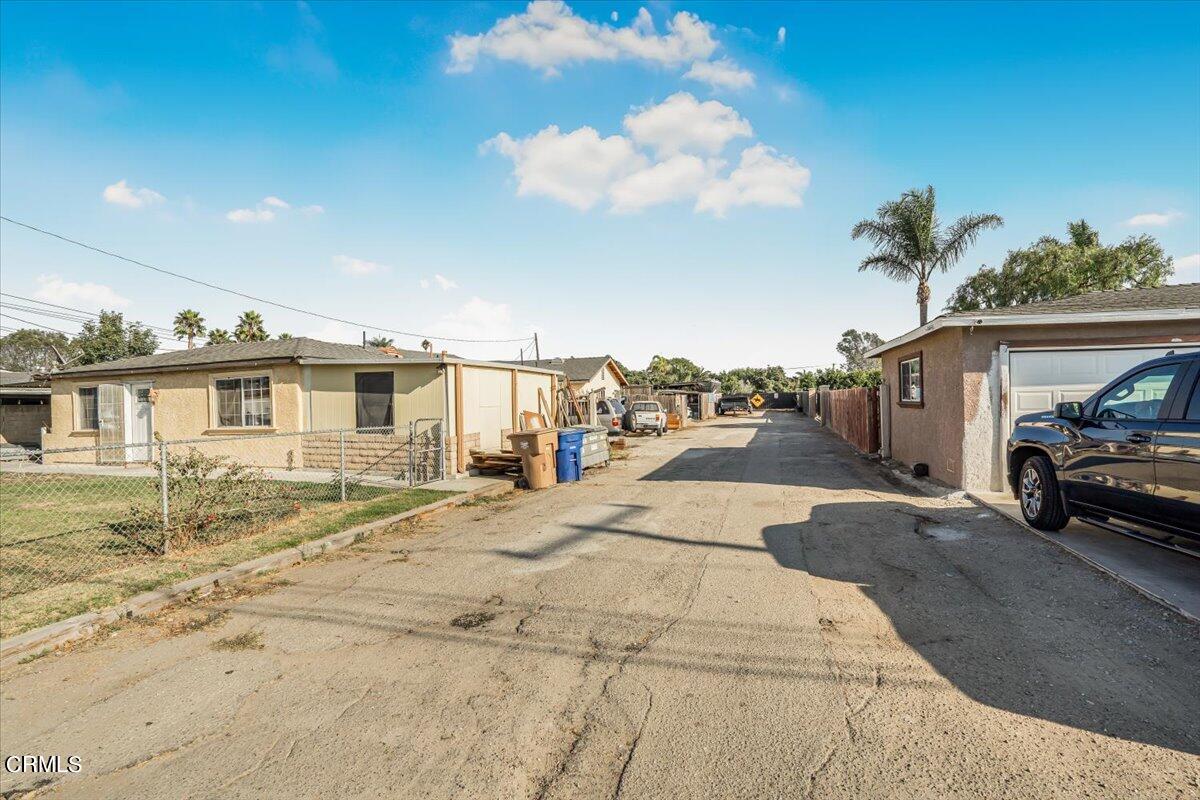 0 Orange Drive Oxnard, CA 93036 - Photo 2 of 9 a front view of a house with a yard and garage
