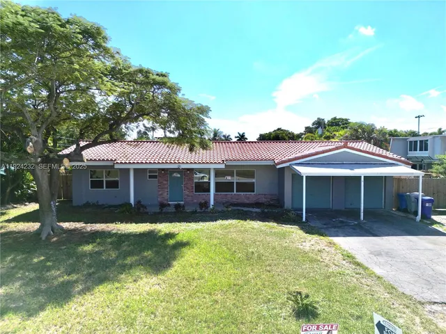 an aerial view of a house with a swimming pool
