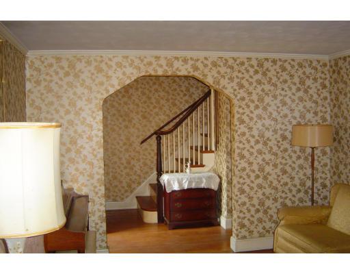 8 Ferncroft Road Boston, MA 02132 - Photo 4 of 11 a bedroom with a bed