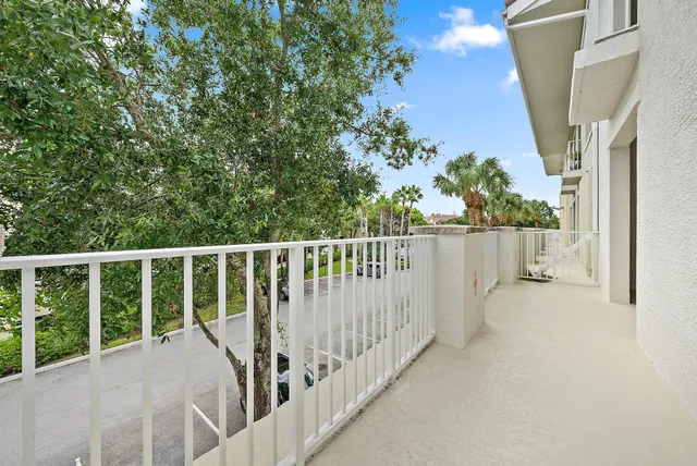 a view of a backyard with a swimming pool