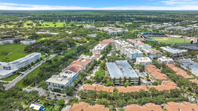 an aerial view of a swimming pool patio and outdoor seating