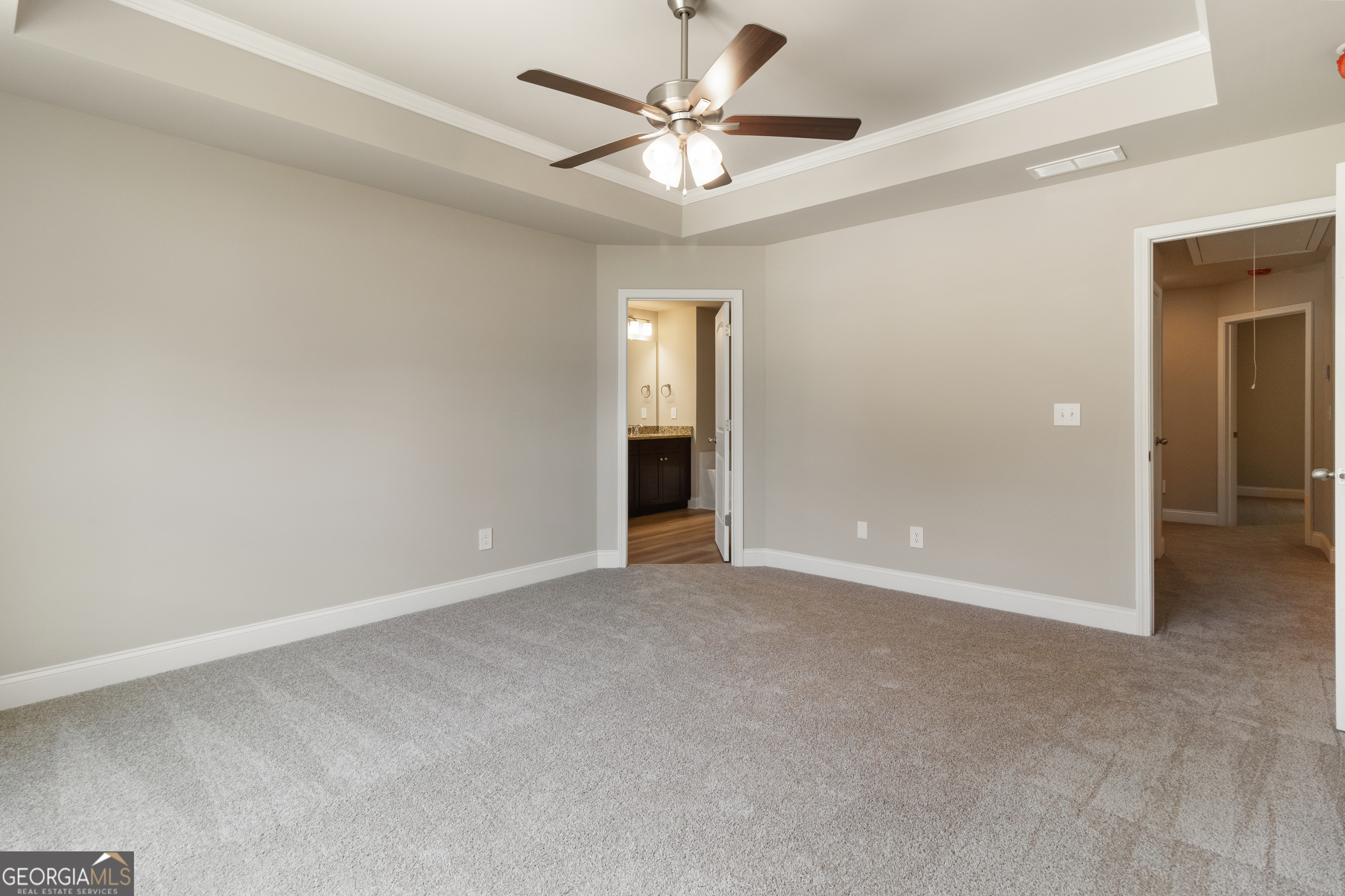 215 Davis Lake Road Thomaston, GA 30286 - Photo 16 of 29 an empty room with a ceiling fan and a window
