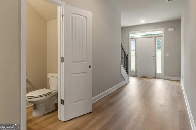 a bathroom with a toilet and a shower