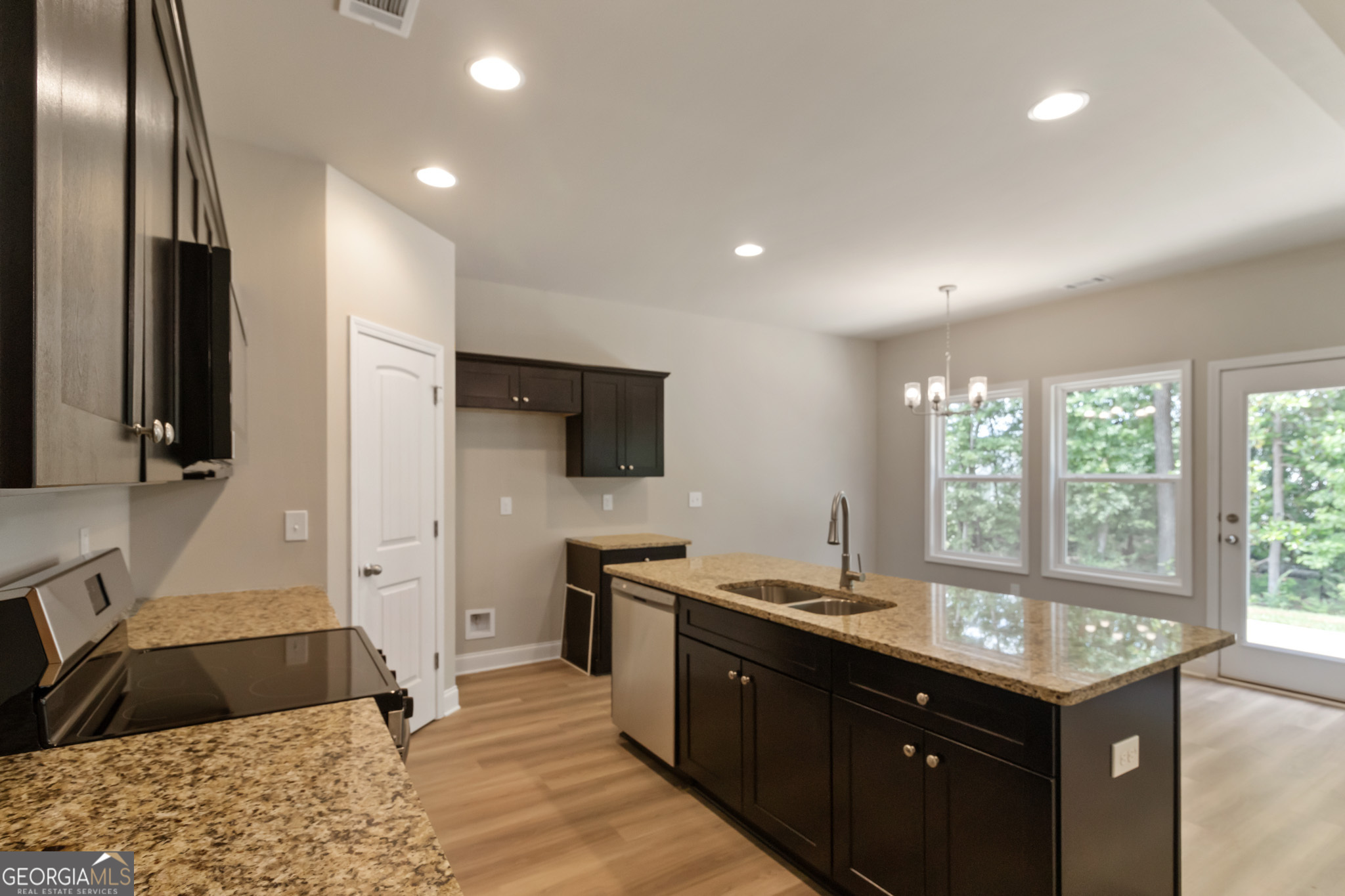 215 Davis Lake Road Thomaston, GA 30286 - Photo 9 of 29 a kitchen with a sink stove and refrigerator
