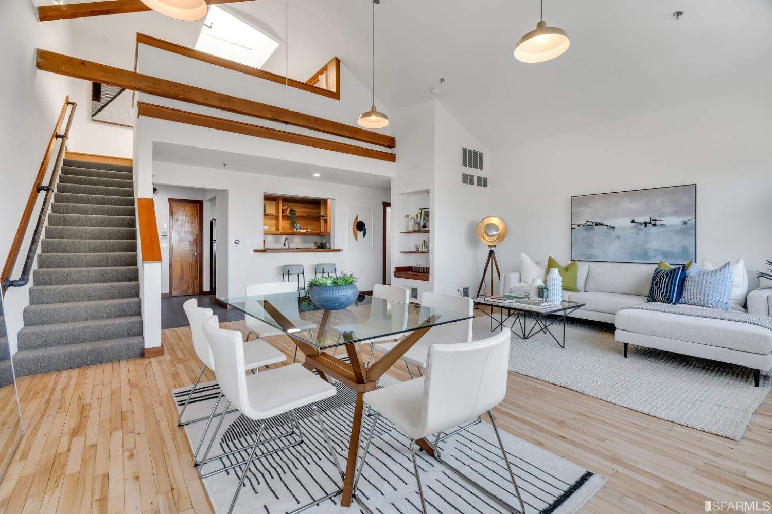 530 East 8th Street, Unit 202 Oakland, CA 94606 - Photo 1 of 27 a living room with furniture and a wooden floor