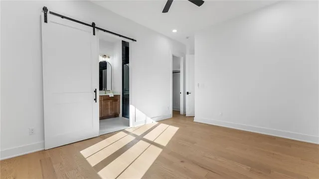 a view of hallway with wooden floor