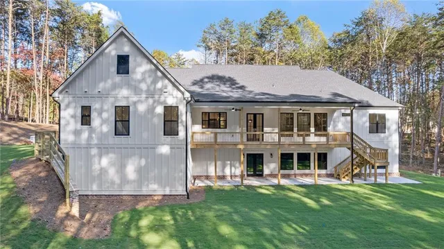 a aerial view of a house next to a yard with plants and trees