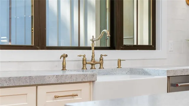 a bathroom with sink and mirror