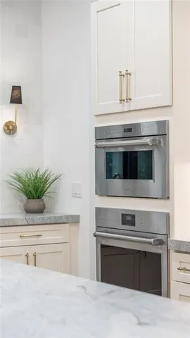 a kitchen with a stove and cabinets