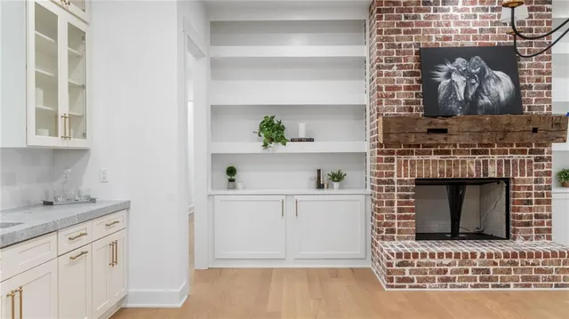a living room with a fireplace and a stove
