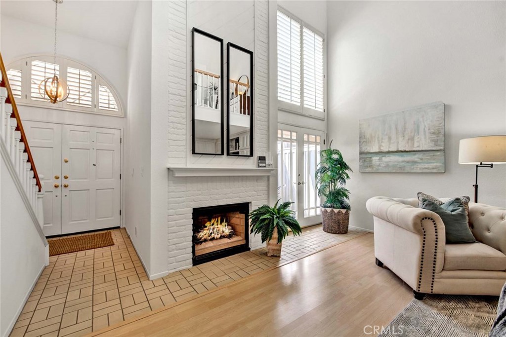 2569 Elden Avenue, Unit A1 Costa Mesa, CA 92627 - Photo 4 of 28 BEAUTIFUL FIREPLACE AND DOUBLE DOORS LEADING TO OUTSIDE PATIO AREA