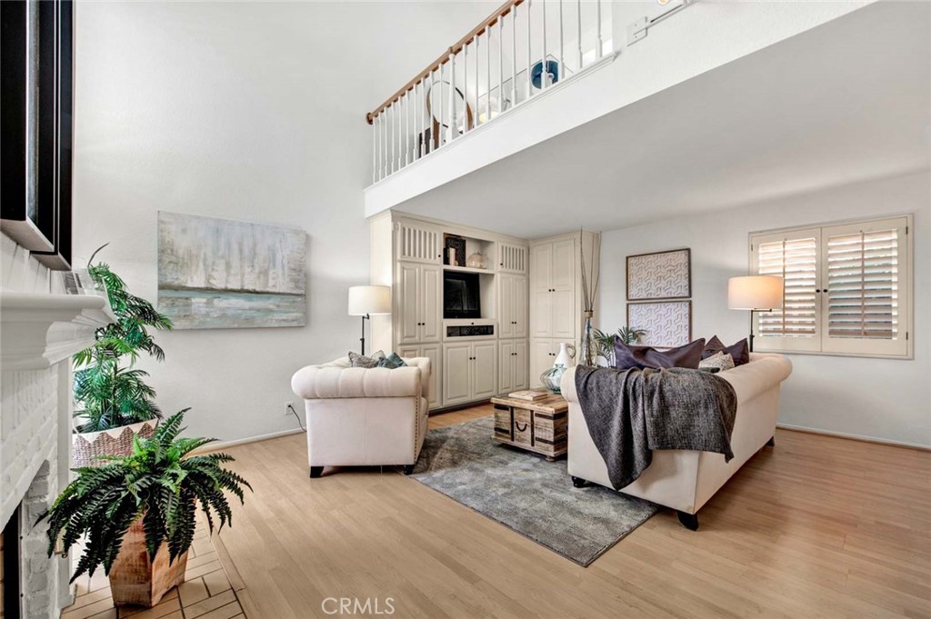 2569 Elden Avenue, Unit A1 Costa Mesa, CA 92627 - Photo 5 of 28 BUILT IN ENTERTAINMENT CENTER, VAULTED CEILINGS, LOFT THAT CAN BE OFFICE OR 3RD BEDROOM