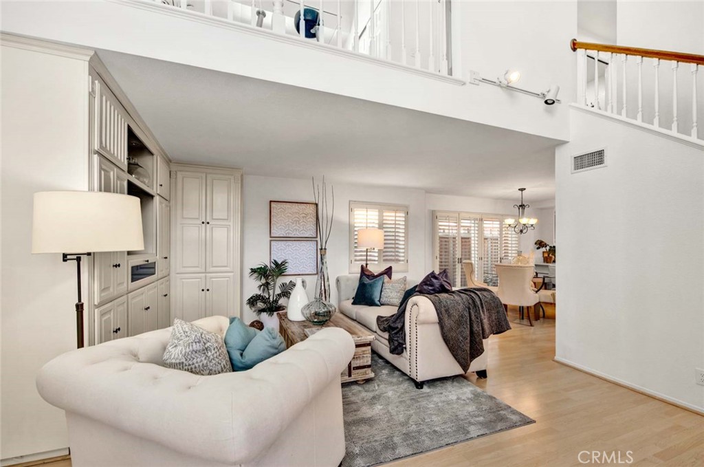 2569 Elden Avenue, Unit A1 Costa Mesa, CA 92627 - Photo 28 of 28 OPEN FLOOR PLAN WHICH FLOWS FROM LIVING ROOM TO DINING AREA AND KITCHEN