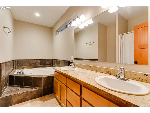 a bathroom with a sink double vanity and a mirror