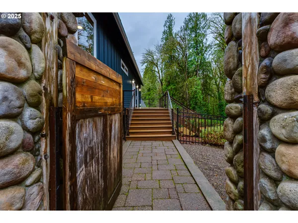 a view of a house with a yard and tree s