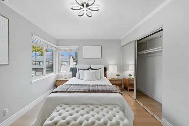 a bedroom with a bed and window