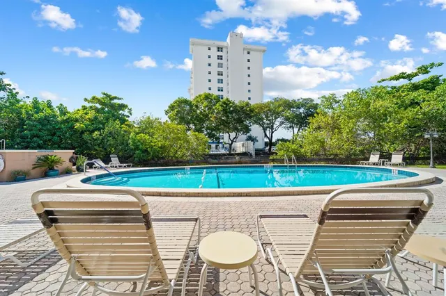 a view of a chairs and table in the patio