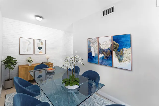 a living room with furniture and flowers