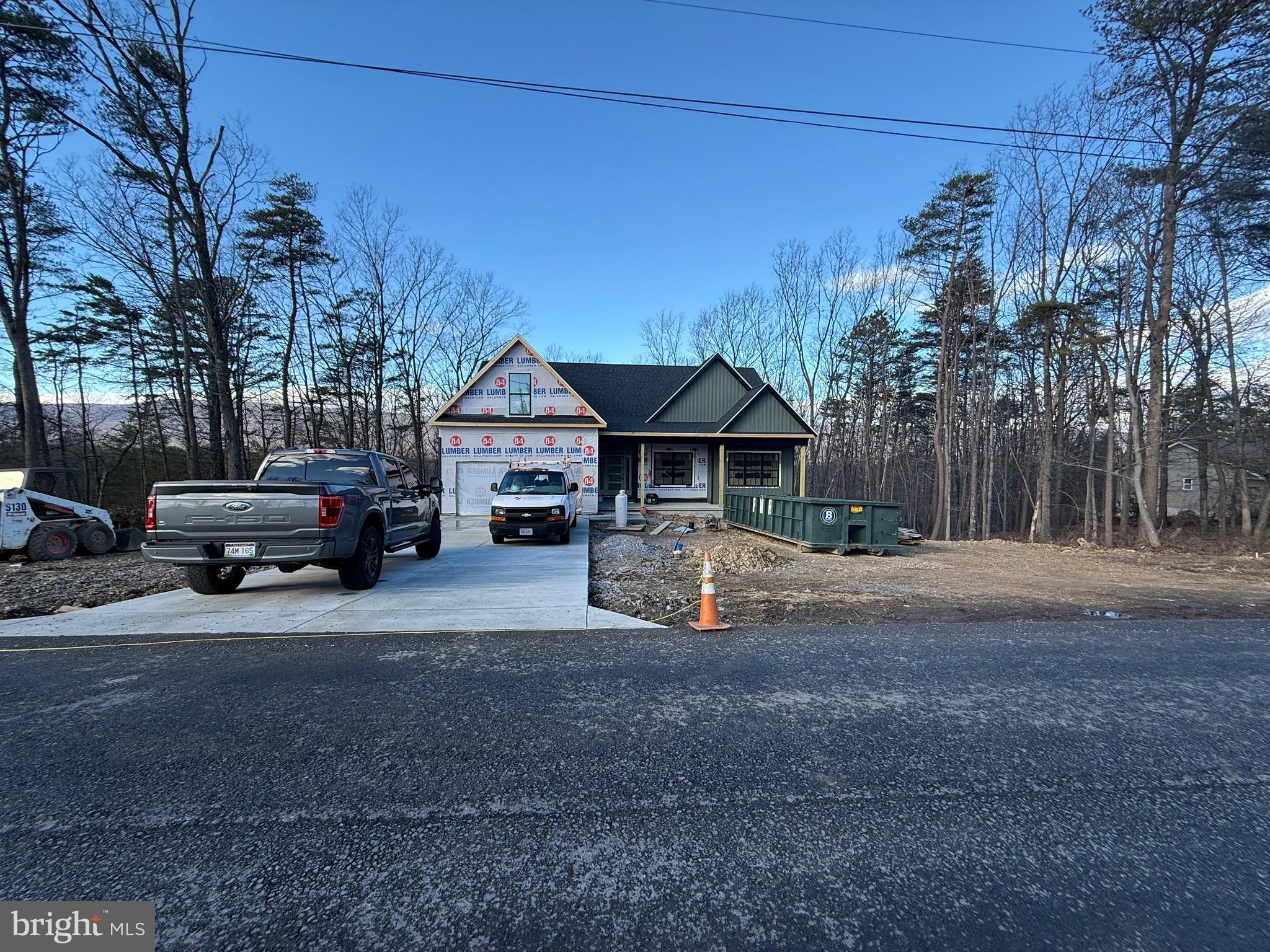 4352 Timber Ridge Road Berkeley Springs, WV 25411 - Photo 2 of 33 a front view of a house with cars parked on road