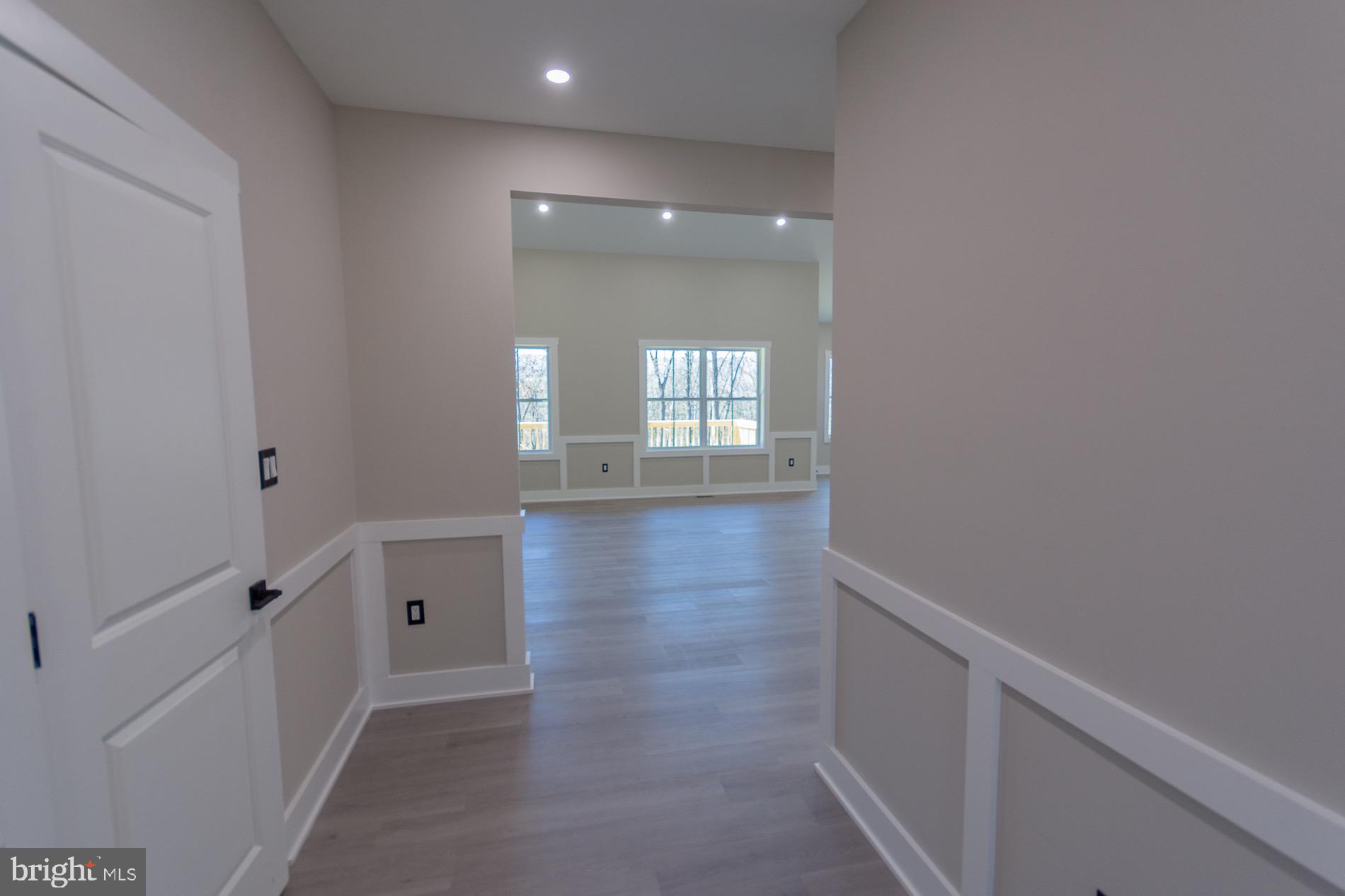 4352 Timber Ridge Road Berkeley Springs, WV 25411 - Photo 27 of 85 a view of a hallway with wooden floor and a bathroom