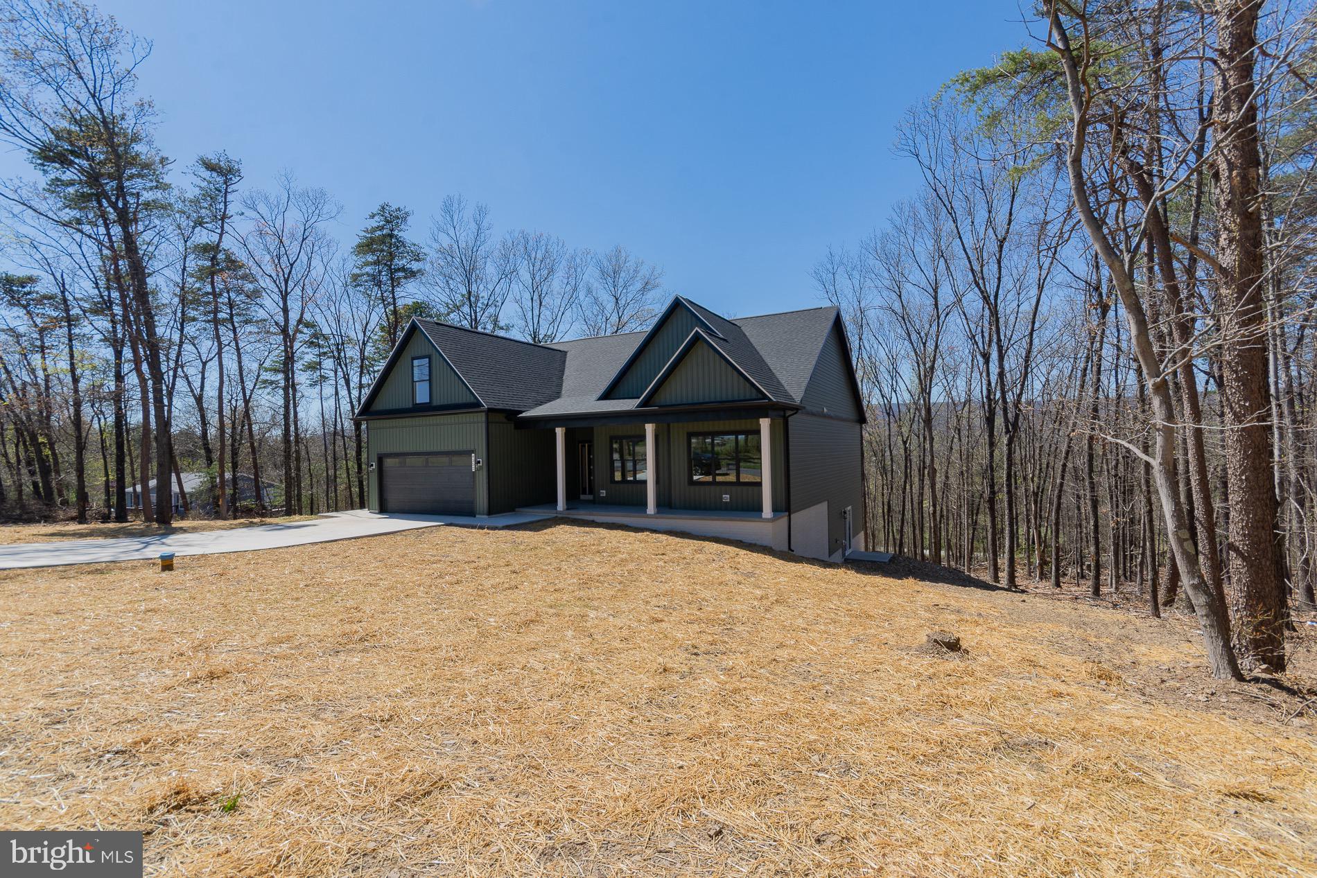 4352 Timber Ridge Road Berkeley Springs, WV 25411 - Photo 4 of 85 a front view of a house with a yard