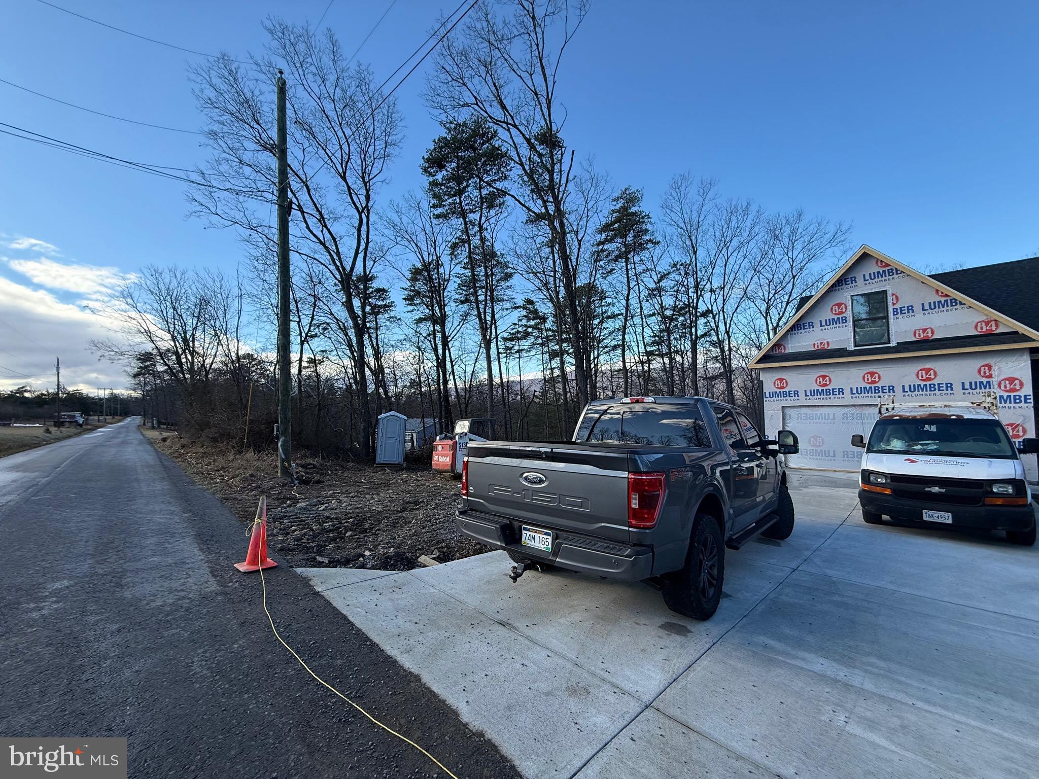 4352 Timber Ridge Road Berkeley Springs, WV 25411 - Photo 4 of 33 a view of a car is parked in front of a house