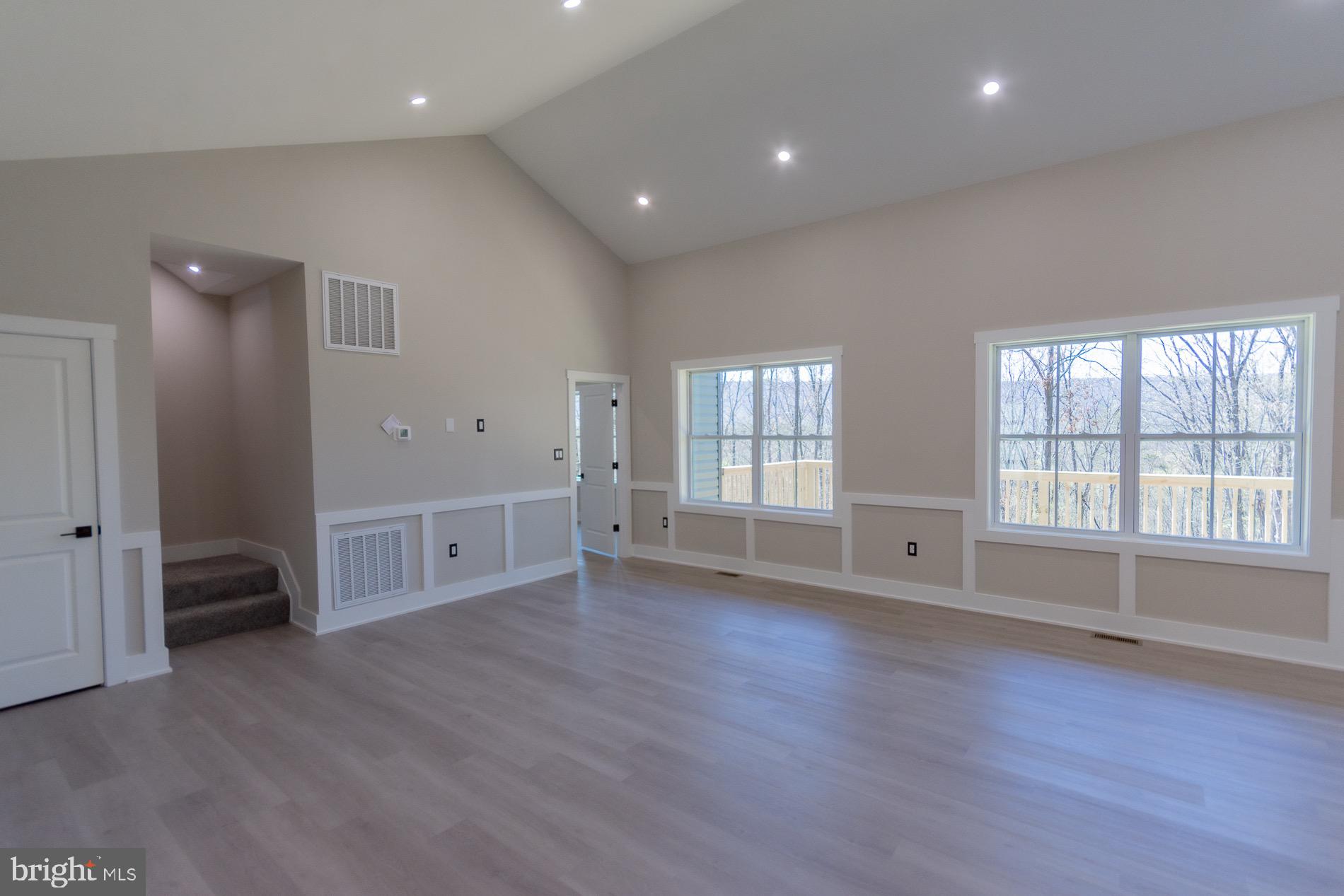 4352 Timber Ridge Road Berkeley Springs, WV 25411 - Photo 41 of 85 a view of an empty room with wooden floor and a window
