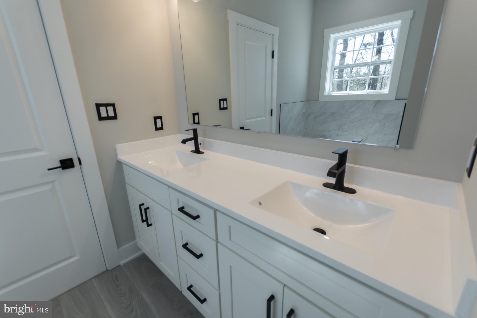 4352 Timber Ridge Road Berkeley Springs, WV 25411 - Photo 63 of 85 a bathroom with a sink and a mirror