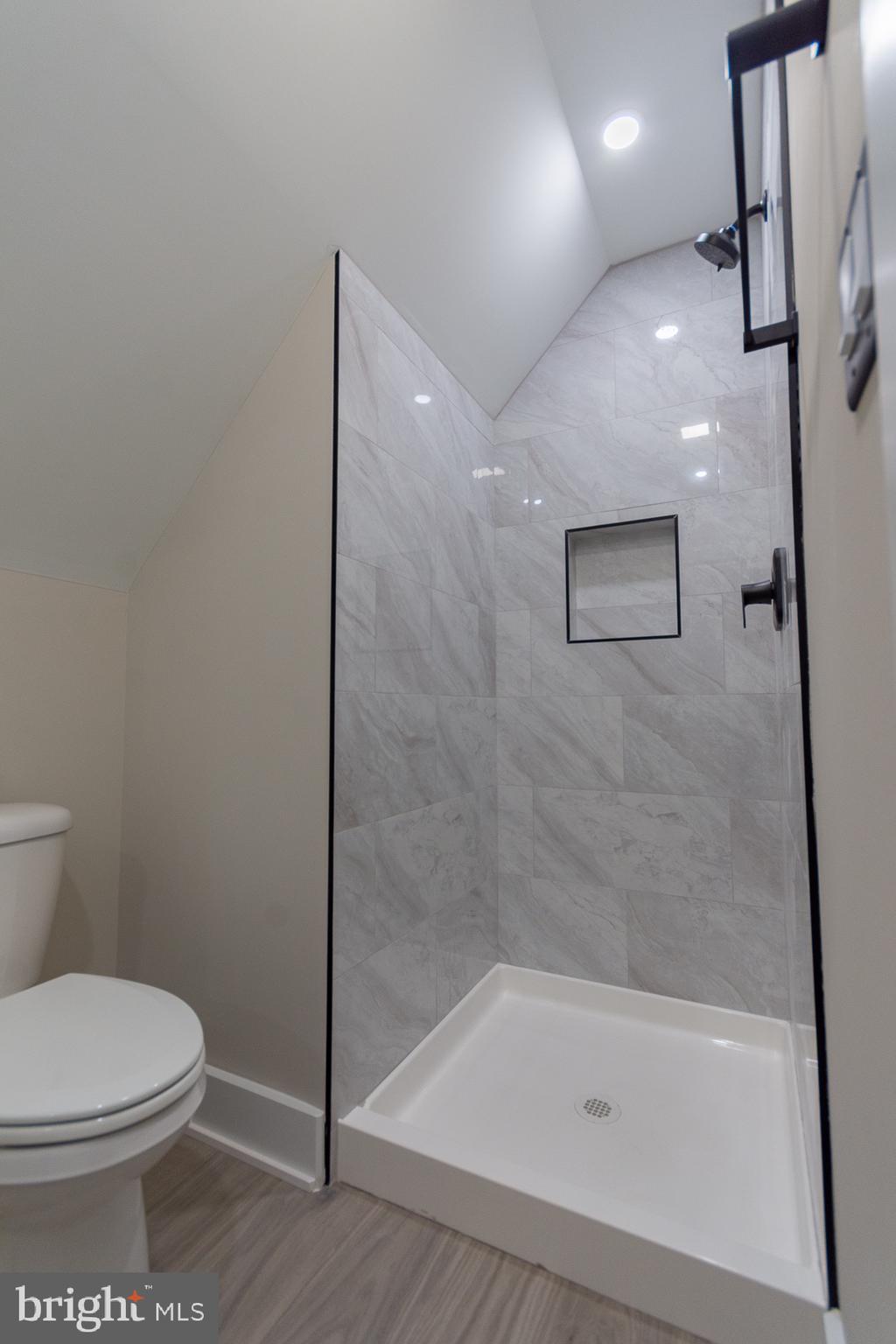 4352 Timber Ridge Road Berkeley Springs, WV 25411 - Photo 71 of 85 a bathroom with a toilet and a shower