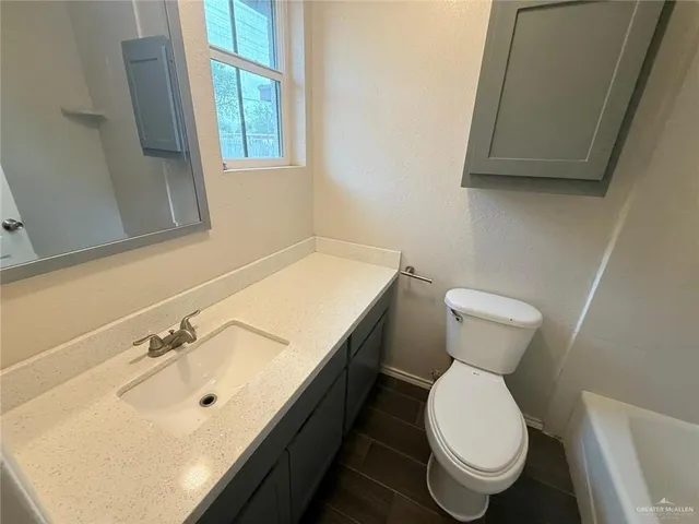 a bathroom with a sink and a toilet