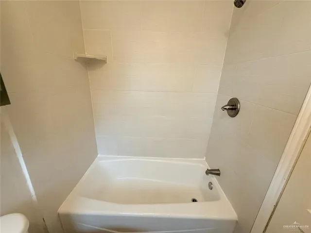 a close up of a bathtub curtain