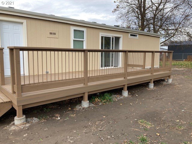 46368 Durham Place Pendleton, OR 97801 - Photo 27 of 32 a backyard of a house with a bench and wooden floor