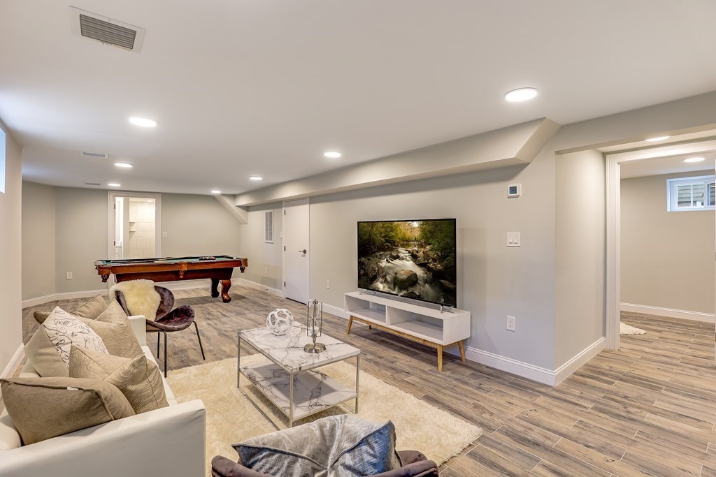 94 Marathon Street, Unit 1 Arlington, MA 02474 - Photo 13 of 24 a living room with furniture and a flat screen tv