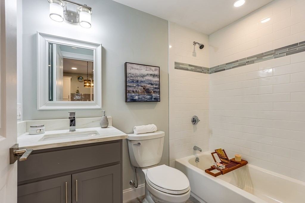 94 Marathon Street, Unit 1 Arlington, MA 02474 - Photo 15 of 24 a bathroom with a sink a toilet and shower